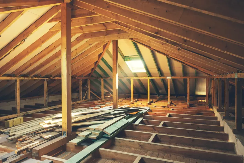 house attic construction. wooden roof beam frame